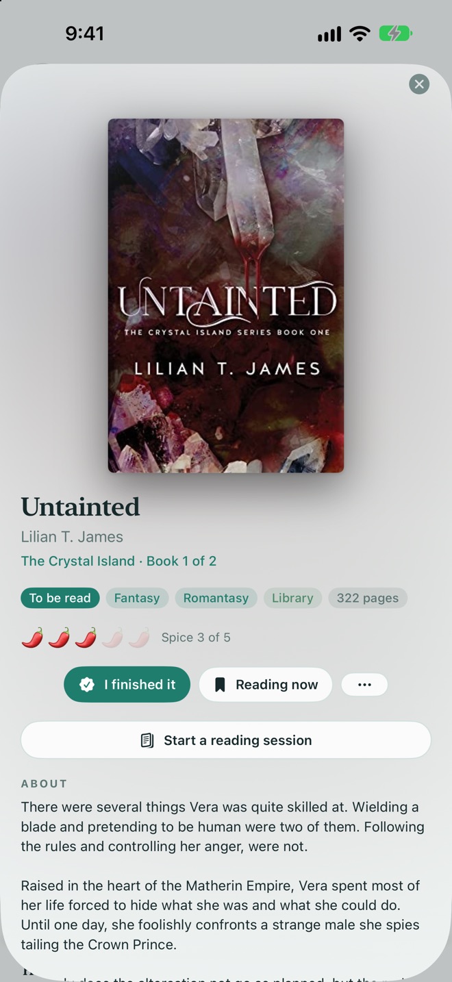 A book page with the cover, series, genre and trope tags, a spice rating, and buttons for I finished it and Reading now